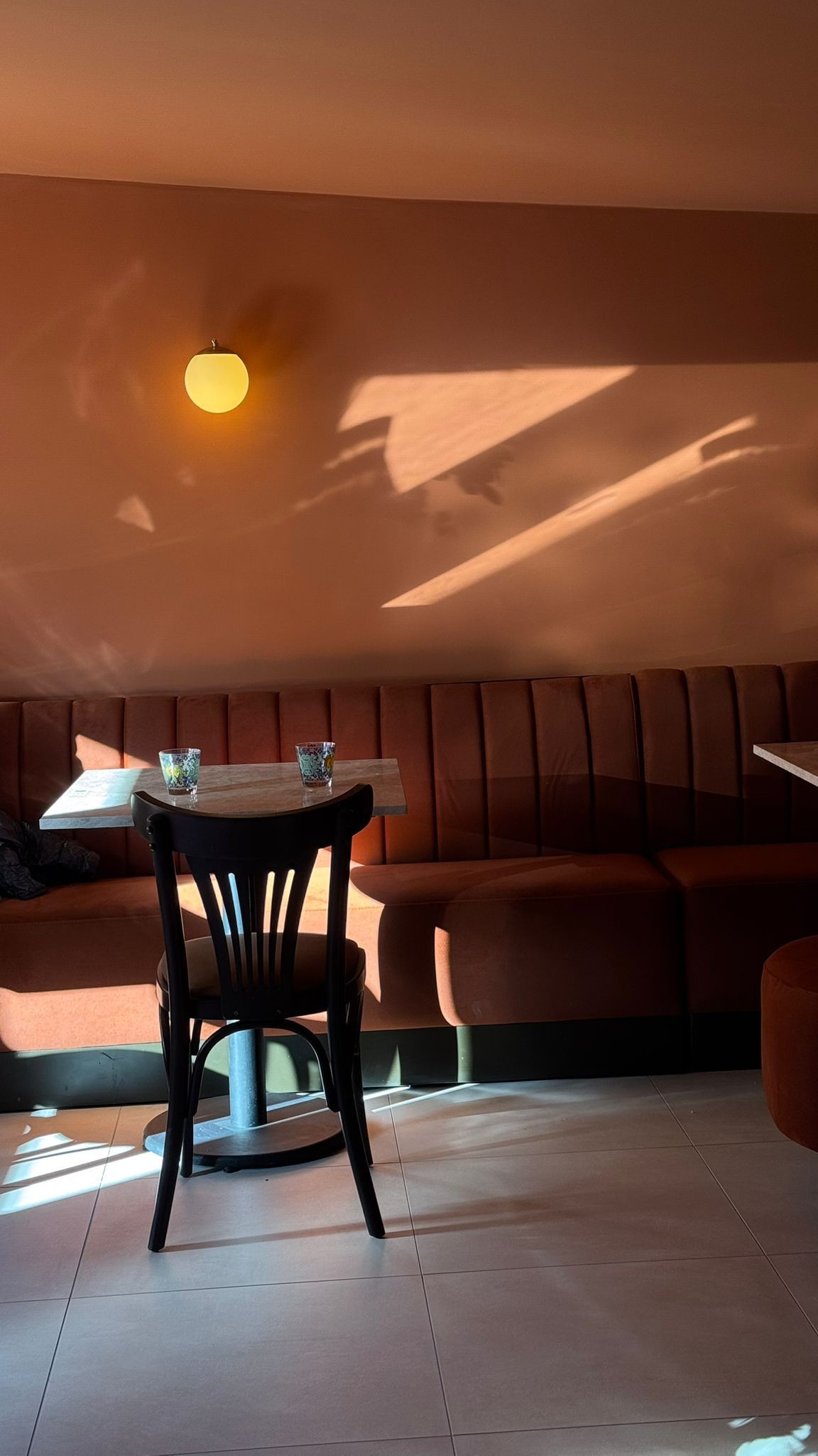 Sunlit interior seating at Cloud Factory Merl