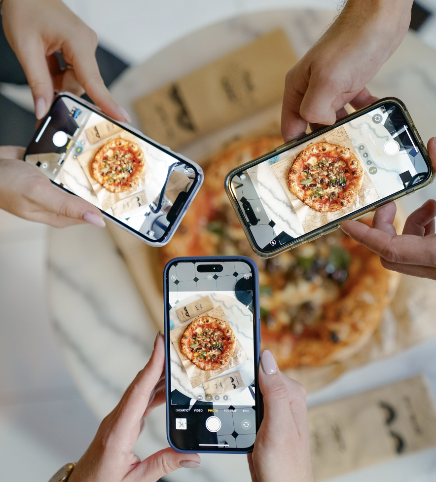 Guests photographing a Cloud Factory pizza in Neudorf